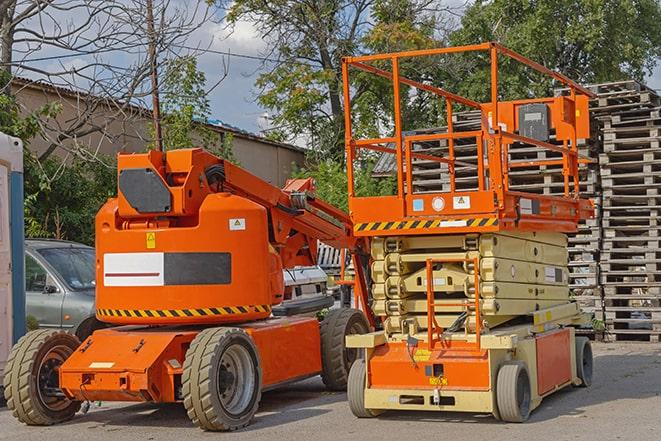 forklift transporting goods in a busy warehouse setting in Keyport